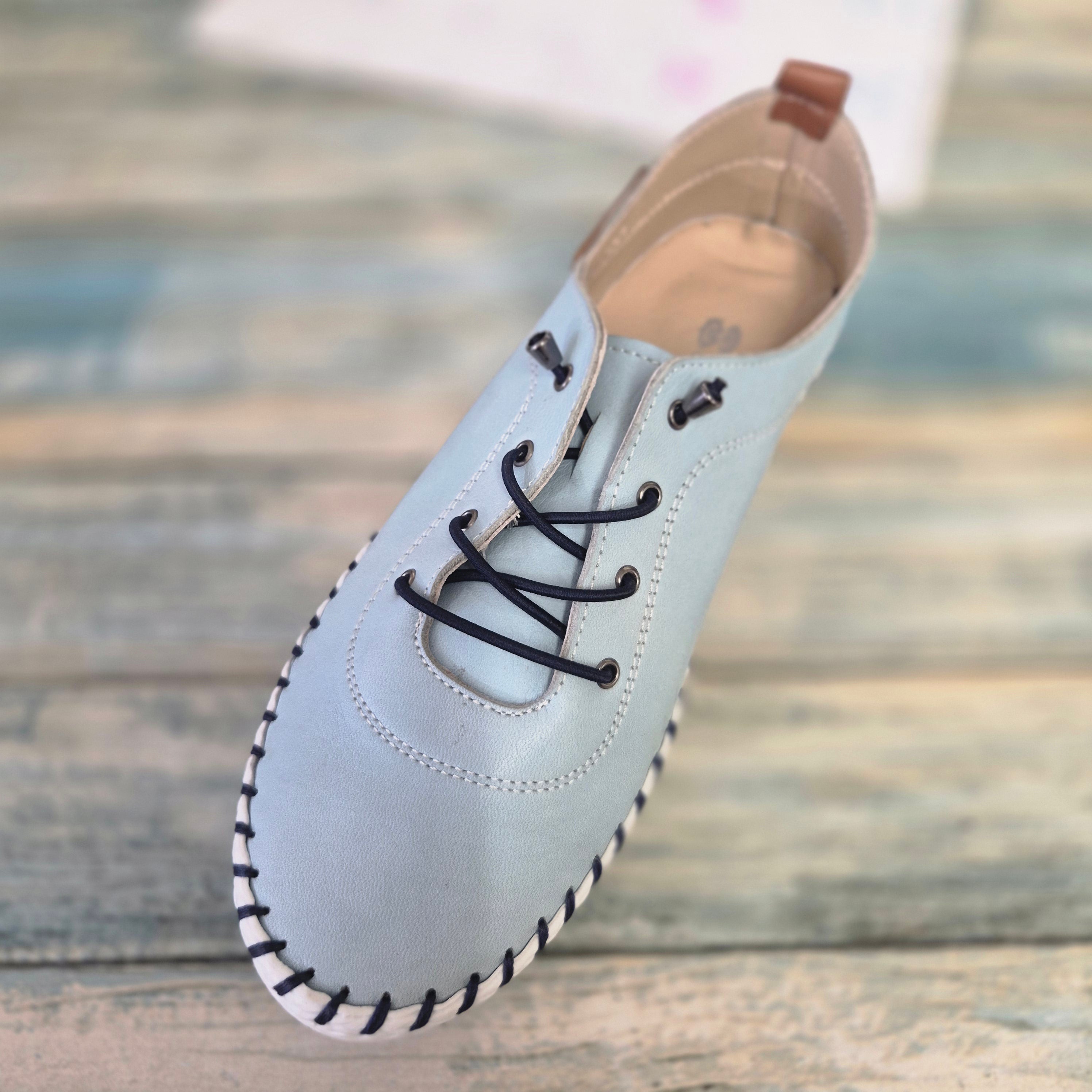 Modella pale blue leather pumps, shoes.